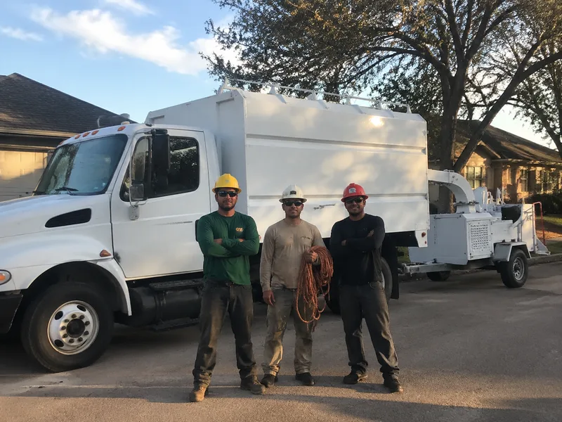 Houston tree care crew with chip truck and equipment